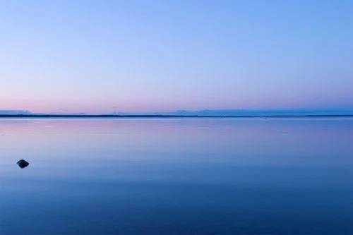 Soft gradient illustration showing sunlight, temperature indicators, and natural environmental layers across a calm sky